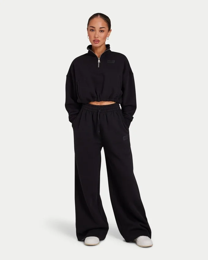 Damen-Jogginghose „Collective“ mit weitem Bein – schwarz Damen-Jogginghose „Collective“ mit weitem Bein – schwarz